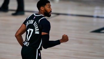 Giannis watches in 2nd half as Nets beat Bucks 119-116