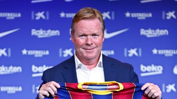 Barcelona hires Koeman, renews its links with Dutch soccer