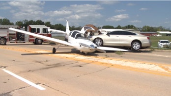 Small plane slides off runway at Illinois airport, stops in street where a car drives up its wing