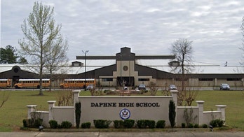 Alabama cheerleaders face backlash after posing with a T-shirt bearing Confederate flag, 'I love Redneck Boys' quote