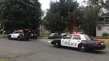 Man charged with killing ex-wife while trying to pick up kids