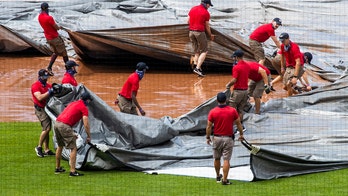 In DC, city of gridlock, tarp stymies Nationals grounds crew