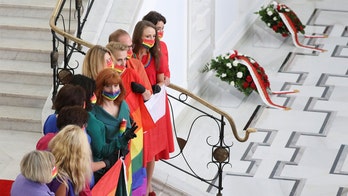 Polish opposition shows rainbow LGBT solidarity at president's swearing-in