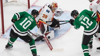 Stars get late goal for 5-4 win over Flames to even series