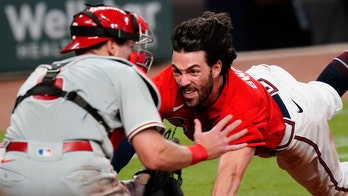 Braves' Brian Snitker advocates for 'blowing up catchers again' after team loses on bang-bang play