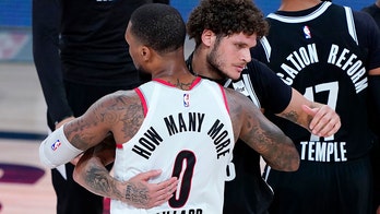 Lillard, Blazers escape Nets, advance to play-in series