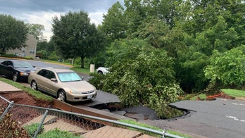 Large sinkhole in Virginia strands hundreds after storms spawn flash flooding, water rescues reported