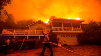 California firefighters fear heat wave, winds will intensify massive LA blaze