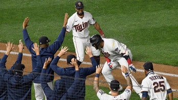 Twins practice socially distant celebrations with phantom high-fives, hugs in fourth straight win