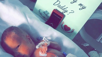 Premature baby 'helps' dad propose to mom from hospital incubator