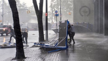 Tropical Storm Isaias' fierce winds toss NYC flood barriers on city streets, injure person