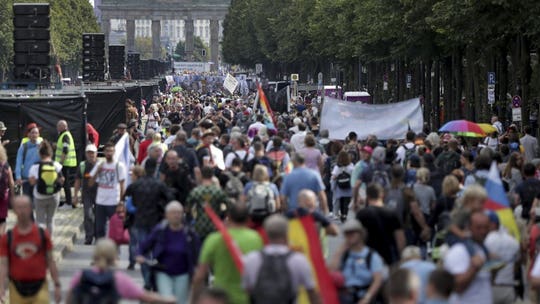 German Chancellor Merkel urges vigilance as thousands gather to protest pandemic restrictions: reports