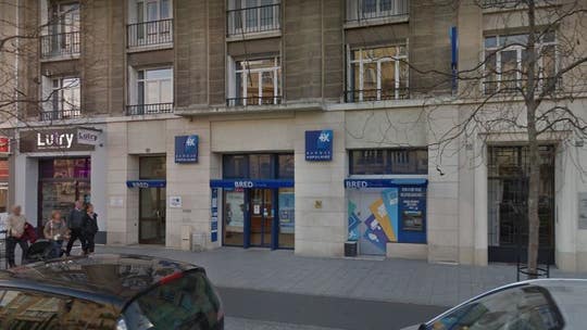 Armed man with ties to radical Islam takes hostages at French bank for six hours, police say