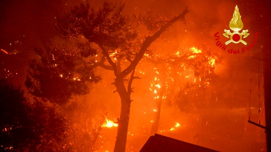 Hurricane-force winds fuel wildfire, topple tree in Italy, killing 2 kids