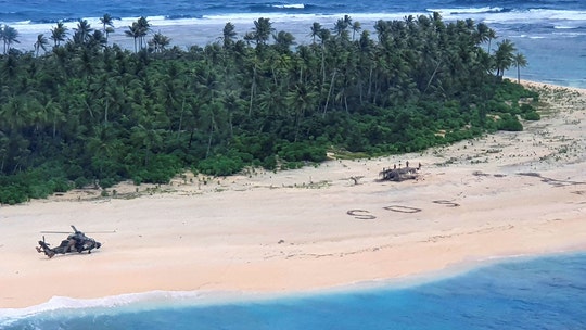 Missing sailors rescued from Pacific island after SOS signal spotted in the sand
