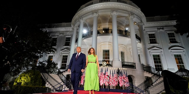 President Donald Trump and first lady Melania Trump arrive for his acceptance speech to the Republican National Committee Convention on the South Lawn of the White House, Thursday, Aug. 27, 2020, in Washington. (AP Photo/Evan Vucci)