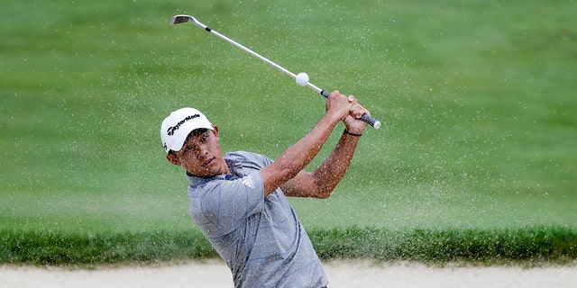 Collin Morikawa hits from a bunker on the 18th hole during opening round of the Workday Charity Open golf tournament, Thursday, July 9, 2020, in Dublin, Ohio. (AP Photo/Darron Cummings)