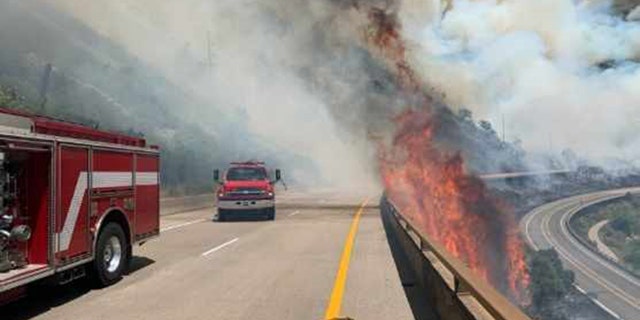 Crews respond to the Grizzly Creek Wildfire burning near Interstate 70 in Colorado on Monday, Aug. 10, 2020.