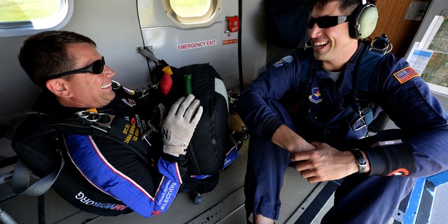 Dana Bowman, retired sergeant first class with the U.S. Army and well-renowned skydiver, and Tech Sgt. Trevor Veitz, U.S. Air Force Wings of Blue jump master, prepares to jump from UV-18B Twin Otter aircraft with the during the Sheppard Air Force Base, Texas, practice air show, Sept. 16, 2016. (U.S. Air Force photo by Senior Airman Kyle E. Gese)