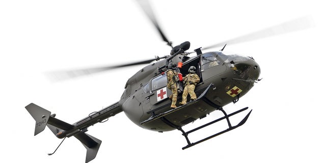 Louisiana National Guardsmen from Delta Company, 2-151st Aviation Regiment conduct recertification training on a LUH-72 Lakota helicopter hoist system used for rescue operations at the Hammond Regional Airport ahead of Hurricane Laura, Aug. 25, 2020. Guardsmen continue to prepare to respond to the citizens of Louisiana prior to landfall of Hurricane Laura. (U.S. Air National Guard photo by Master Sgt. Toby Valadie)