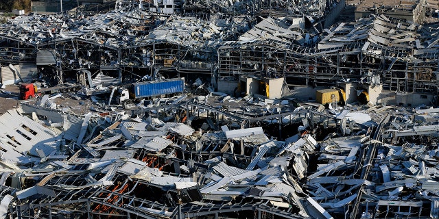 A general view of the scene of an explosion that hit the seaport of Beirut, Lebanon, Wednesday, Aug. 5, 2020. (AP Photo/Bilal Hussein)