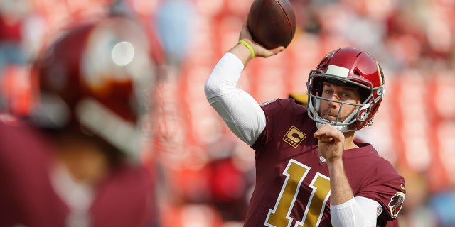 FILE - Washington Redskins quarterback Alex Smith (11) warms up before an NFL football game against the Houston Texans, in a Sunday, Nov. 18, 2018.(AP Photo/Pablo Martinez Monsivai, Files)