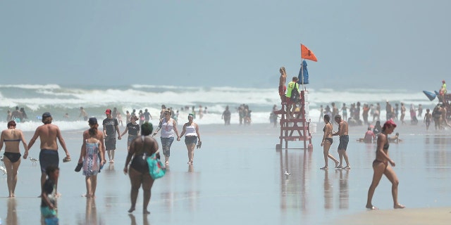 Daytona Beach, Fla., crowded with beachgoers Saturday, Aug. 1, 2020. (Stephen M. Dowell/Orlando Sentinel via AP)