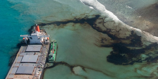 This photo provided by the French Army shows oil leaking from the MV Wakashio, a bulk carrier ship that ran aground off the southeast coast of Mauritius, Tuesday Aug.11, 2020.