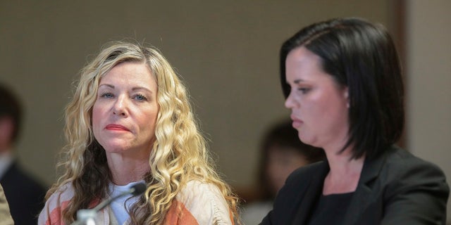Lori Vallow Daybell glances at the camera during her hearing, with her defense attorney, Edwina Elcox, right, in Rexburg, Idaho. Arizona authorities said she will most likely be charged in connection with the death of her former husband.