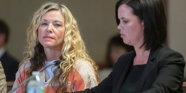 Lori Vallow Daybell glances at the camera during her hearing, with her defense attorney, Edwina Elcox, right, in Rexburg, Idaho. Arizona authorities said she will most likely be charged in connection with the death of her former husband.