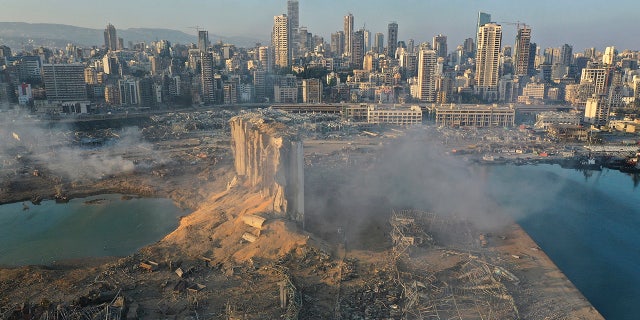 A drone picture shows the scene of an explosion at the seaport of Beirut, Lebanon, Wednesday, Aug. 5, 2020. (AP Photo/Hussein Malla)
