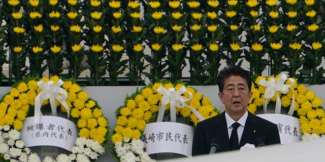 Japanese Prime Minister Shinzo Abe delivers a speech during a ceremony to mark the 75th anniversary of the bombing at the Hiroshima Peace Memorial Park Thursday, Aug. 6, 2020, in Hiroshima, western Japan. (AP Photo/Eugene Hoshiko)