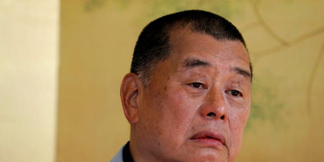 FILE: Hong Kong media tycoon Jimmy Lai pauses during an interview in Hong Kong. 