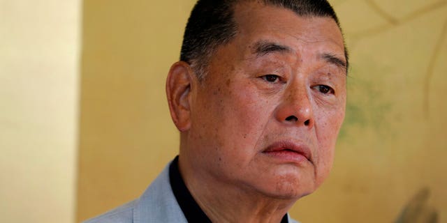 FILE: Hong Kong media mogul Jimmy Lai pauses for an interview in Hong Kong.