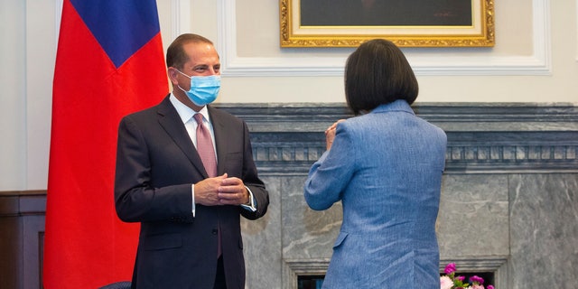 Azar, left, is greeted by Taiwan's President Tsai Ing-wen, right, during a meeting in Taipei, Monday, Aug. 10, 2020. (Pool Photo via AP Photo)