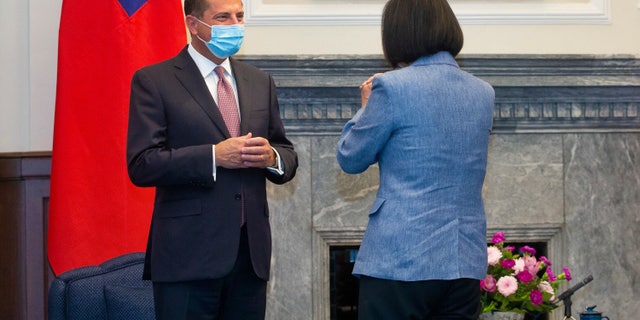Azar, left, is greeted by Taiwan's President Tsai Ing-wen, right, during a meeting in Taipei, Monday, Aug. 10, 2020. (Pool Photo via AP Photo)