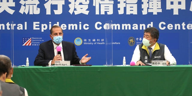 Azar, left, and Taiwanese Minister of Health and Welfare Chen Shih-chung answer questions from media at the Central Epidemic Command Center in Taipei, Taiwan, Monday, Aug. 10, 2020. (AP Photo/Chiang Ying-ying)