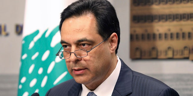 In this March. 7, 2020 file photo released by the Lebanese Government, Lebanese Prime Minister Hassan Diab, gives a speech at the Government House in Beirut, Lebanon. In a brief televised speech, Monday, Aug. 10, 2020, Diab said he is stepping down from his job in the wake of the Beirut port explosion last week that triggered public fury and mass protests. (Dalati Nohra/Lebanese Government via AP, File )