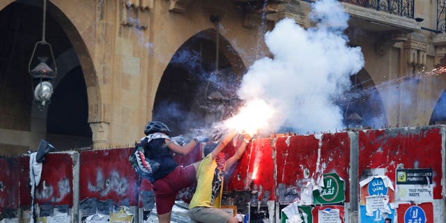 Anti-government protesters in Beirut, Lebanon, on Monday, Aug. 10, 2020. (AP Photo/Hassan Ammar)