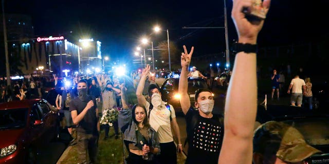 People gather during a mass protest following presidential elections in Minsk, Belarus, Monday, Aug. 10, 2020. 