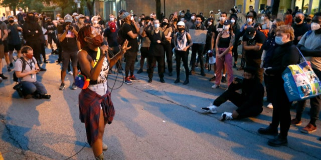 Ariel Atkins, seen here with the microphone, also blasted the response from Chicago Mayor Lori Lightfoot.