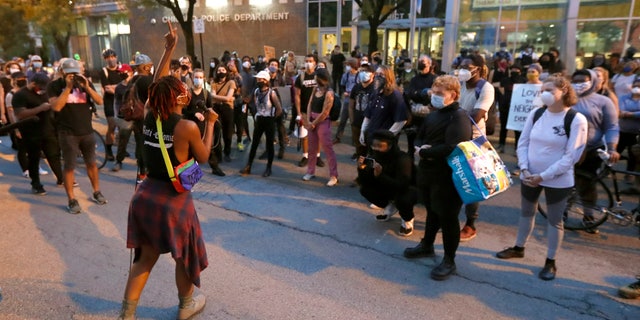 Ariel Atkins, a lead organizer for Black Lives Matter Chicago, leads a protest Aug. 10, outside the Chicago Police Department's District 1 station in Chicago. (AP Photo/Charles Rex Arbogast)