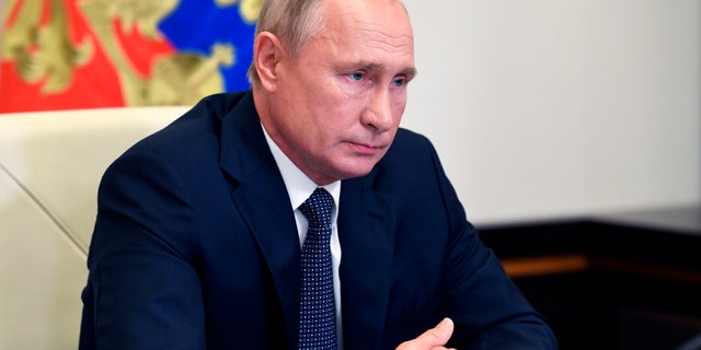 Russian President Vladimir Putin attends a cabinet meeting at the Novo-Ogaryovo residence outside Moscow, Russia, Tuesday, Aug. 11, 2020. (Alexei Nikolsky, Sputnik, Kremlin Pool Photo via AP)