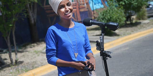 Democrat Rep. Ilhan Omar addresses media after lunch at the Mercado Central in Minneapolis Tuesday, Aug. 11, 2020, primary Election Day in Minnesota. (AP Photo/Jim Mone)