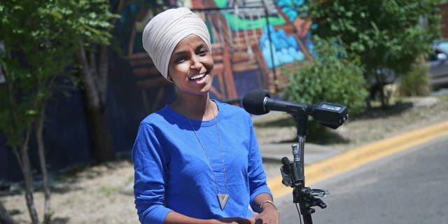 Democrat Rep. Ilhan Omar addresses media after lunch at the Mercado Central in Minneapolis Tuesday, Aug. 11, 2020, primary Election Day in Minnesota. (AP Photo/Jim Mone)