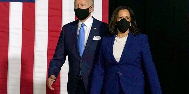 President Biden and Vice President Harris, then candidates, arrive to speak during a news conference at Alexis Dupont High School in Wilmington, Del., Wednesday, Aug. 12, 2020. 
