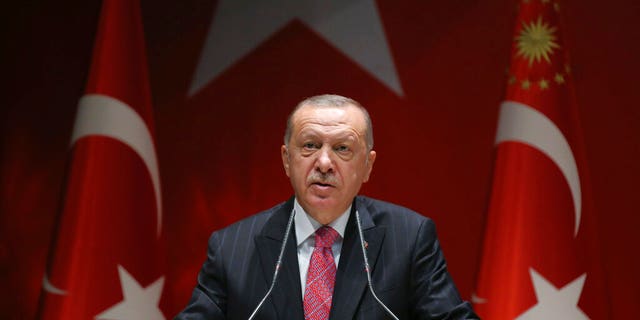 Turkey's President Recep Tayyip Erdogan addresses his party members, in Ankara, Turkey, Thursday, Aug. 13, 2020.