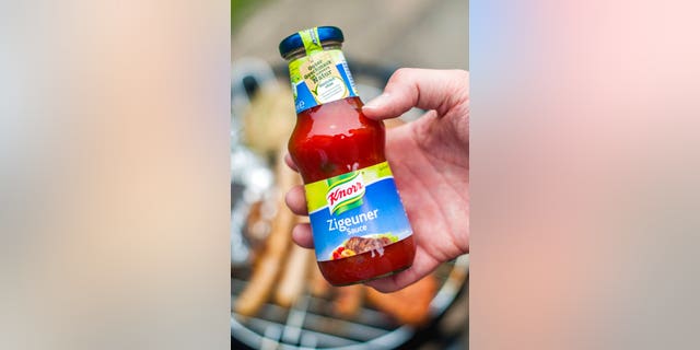 FILE: A man holds a bottle of "gypsy sauce" from the manufacturer Knorr in his hand in Berlin, Germany. 