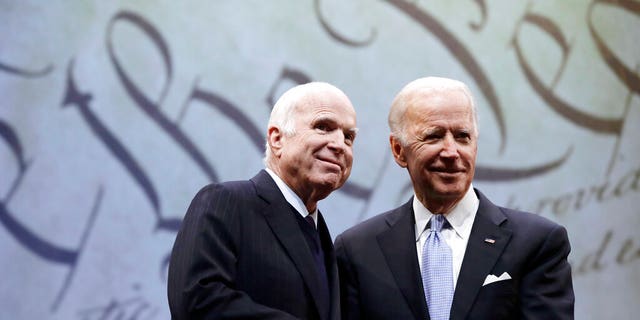 Sen. John McCain, R-Ariz., receives the Liberty Medal from Chair of the National Constitution Center's Board of Trustees, former Vice President Joe Biden, in Philadelphia.