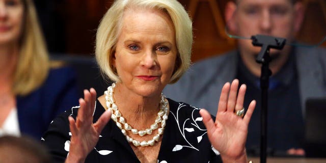 Cindy McCain waves to the crowd after being acknowledged by Arizona Republican Gov. Doug Ducey during his State of the State address.